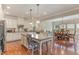 Modern kitchen with granite countertops and stainless steel appliances at 1329 Endgame Ct, Wake Forest, NC 27587