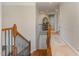 Upstairs hall with carpet and wooden railing at 1329 Endgame Ct, Wake Forest, NC 27587