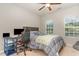Cozy bedroom with a double bed, desk and chair, and two windows at 1329 Endgame Ct, Wake Forest, NC 27587