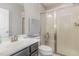Clean bathroom with shower and dark vanity at 1329 Endgame Ct, Wake Forest, NC 27587