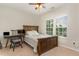 Charming bedroom with a full-size bed, a desk, and a ceiling fan at 1329 Endgame Ct, Wake Forest, NC 27587