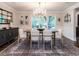 Bright dining room with hardwood floors, chandelier, and large windows at 106 Dundee Ct, Cary, NC 27511