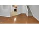 Open concept living space with hardwood floors and kitchen views at 320 Gilman Ln # 110, Raleigh, NC 27610