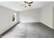 Primary bedroom with ceiling fan and grey carpeting at 320 Gilman Ln # 110, Raleigh, NC 27610