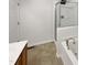 Bathroom with a tub, shower, and updated fixtures at 320 Gilman Ln # 110, Raleigh, NC 27610