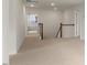 Upstairs hallway with carpeted floors and access to bedrooms at 245 Umstead St, Sanford, NC 27330