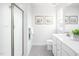 Bright bathroom with walk-in shower, double vanity, and gray tile floor at 8805 Tartan Clan Dr, Willow Springs, NC 27592