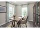 Bright home office with built-in shelving and plenty of natural light at 8805 Tartan Clan Dr, Willow Springs, NC 27592