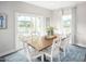 Dining room with a wooden table and access to backyard deck at 8805 Tartan Clan Dr, Willow Springs, NC 27592