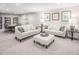 Spacious finished basement with sectional sofa, ottoman, and game table at 8805 Tartan Clan Dr, Willow Springs, NC 27592