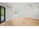 Bright living room with hardwood floors, recessed lighting, and access to backyard at 111 November Dr, Durham, NC 27712