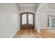 Elegant entryway, featuring hardwood floors and double doors at 111 November Dr, Durham, NC 27712