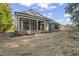 Gray two-story house with covered patio, and unfinished yard at 111 November Dr, Durham, NC 27712