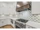 Modern kitchen with stainless steel appliances and patterned backsplash at 111 November Dr, Durham, NC 27712