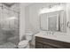 Modern bathroom with frameless shower, quartz vanity, and gold fixtures at 111 November Dr, Durham, NC 27712