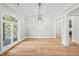 Formal dining room with hardwood floors and arched window at 111 November Dr, Durham, NC 27712