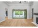 Open living area with hardwood floors and stunning views of the backyard patio at 111 November Dr, Durham, NC 27712