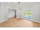 Dining room with hardwood floors and a large window at 111 November Dr, Durham, NC 27712