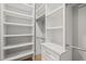 Bright walk-in closet with built in shelves at 111 November Dr, Durham, NC 27712