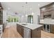 Spacious kitchen island with sink, breakfast bar, and stainless steel appliances at 111 November Dr, Durham, NC 27712