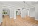 Open concept dining room with hardwood floors and chandelier at 111 November Dr, Durham, NC 27712