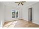 Light-filled bedroom featuring hardwood floors and a ceiling fan at 111 November Dr, Durham, NC 27712