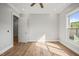 Bright bedroom with hardwood floors and large window at 111 November Dr, Durham, NC 27712