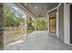 Covered patio with stone flooring and backyard views; partially landscaped at 111 November Dr, Durham, NC 27712