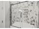 Modern shower with marble tile and glass enclosure at 111 November Dr, Durham, NC 27712