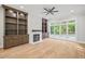 Spacious living room with built-in shelving, fireplace and hardwood floors at 111 November Dr, Durham, NC 27712