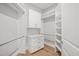 Spacious walk-in closet with custom shelving and hanging rods at 111 November Dr, Durham, NC 27712