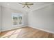 Light-filled bedroom featuring hardwood floors at 111 November Dr, Durham, NC 27712