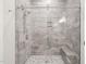 Large walk-in shower with marble tile at 111 November Dr, Durham, NC 27712