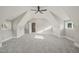 Spacious bedroom with sloped ceilings, and ceiling fan at 109 November Dr, Durham, NC 27712