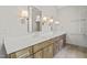 Double vanity bathroom with quartz countertop and elegant lighting at 109 November Dr, Durham, NC 27712