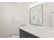 Bathroom with dark vanity, white countertop and large mirror at 109 November Dr, Durham, NC 27712