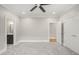 Spacious bedroom with ceiling fan, carpet, and ensuite bathroom access at 109 November Dr, Durham, NC 27712