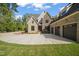Brick home with three-car garage and large driveway at 109 November Dr, Durham, NC 27712