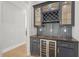 Custom wet bar with wine storage and dark wood countertop at 109 November Dr, Durham, NC 27712