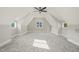Bright bedroom with sloped ceilings, two windows and ceiling fan at 109 November Dr, Durham, NC 27712