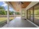 Covered patio with stone pavers, ceiling fan, and access to backyard at 109 November Dr, Durham, NC 27712