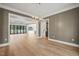 Open dining room with hardwood floors and views of the Gathering room and pool at 109 November Dr, Durham, NC 27712