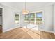Breakfast nook with hardwood floors and large windows at 109 November Dr, Durham, NC 27712