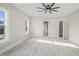 Spacious bedroom with carpet, windows, and access to other rooms at 109 November Dr, Durham, NC 27712