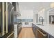 Modern kitchen with white cabinets, blue tile backsplash and black appliances at 109 November Dr, Durham, NC 27712
