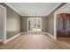 Elegant dining room with hardwood floors, chandelier, and geometric wall detail at 109 November Dr, Durham, NC 27712