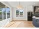 Bright breakfast nook with large windows and hardwood floors at 109 November Dr, Durham, NC 27712