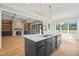 Modern kitchen with large island, stainless steel appliances, and custom cabinetry at 109 November Dr, Durham, NC 27712