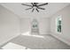 Bright bedroom with vaulted ceiling, carpet, and multiple windows at 109 November Dr, Durham, NC 27712