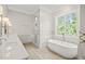 Bathroom with soaking tub, double vanity, and walk-in shower at 109 November Dr, Durham, NC 27712